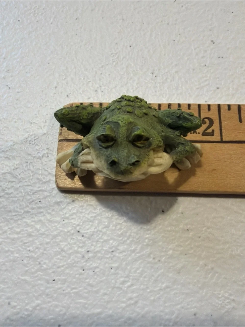 Porcelain Frog Statue 1 inch tall With A Goofy Look On His Face